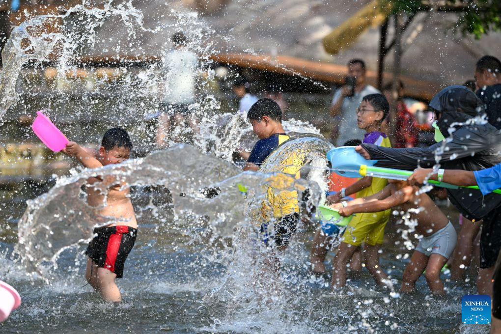 Tourists play at a water park in Tianjin, north China, Aug. 4, 2026. (Xinhua/Sun Fanyue)