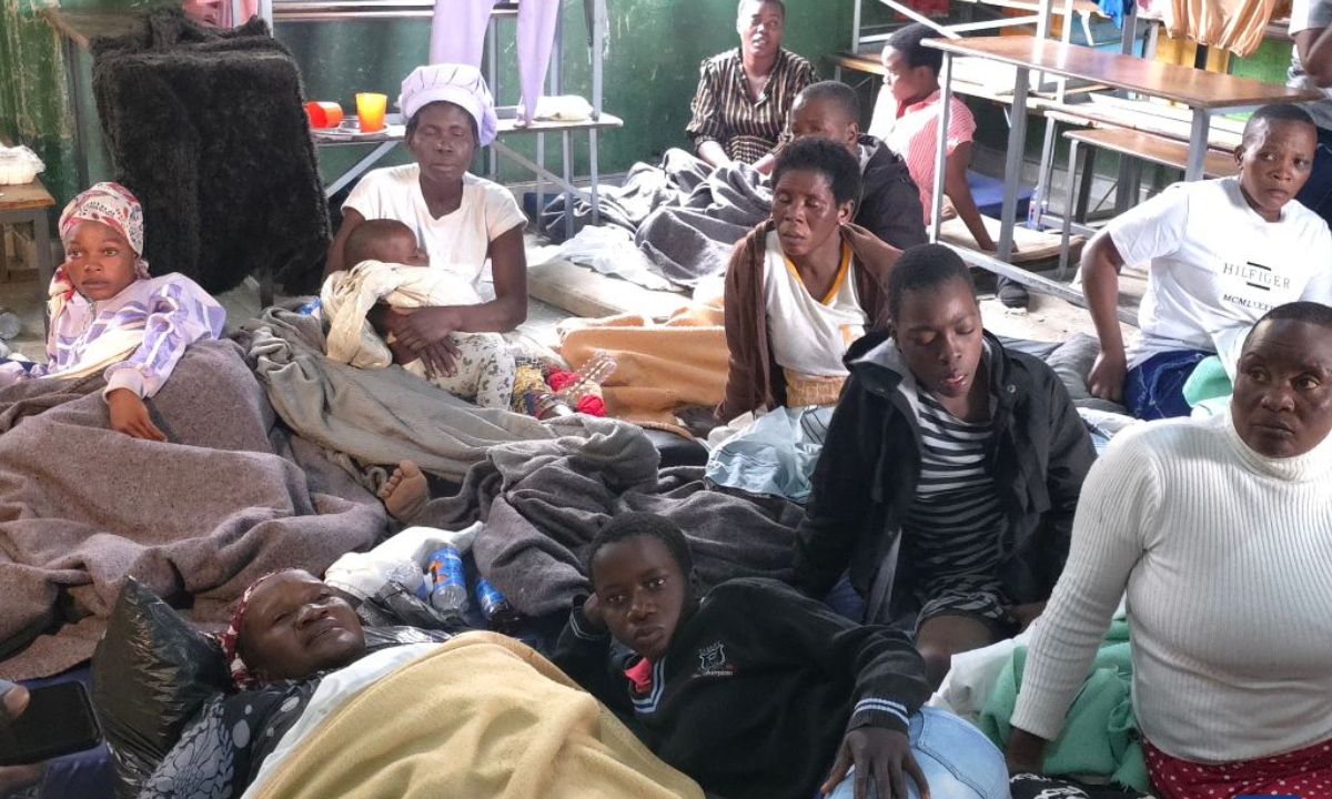 Photo taken with a mobile phone shows survivors of a boat capsize on Lake Kariba taking shelter at a school in Mashonaland West Province, Zimbabwe, on August 12, 2026. Zimbabwean President Emmerson Mnangagwa on Wednesday declared a state of disaster following a boat capsize in Lake Kariba, as police confirmed the death toll from the tragedy had risen to 44. (Str/Xinhua)