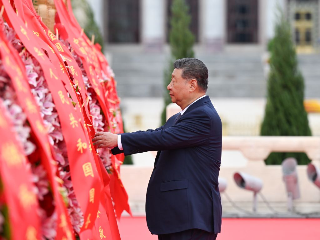 Chinese President Xi Jinping straightens the ribbon on a flower basket during a ceremony to present flower baskets to fallen national heroes at Tian'anmen Square in Beijing, capital of China, Sept. 30, 2026. Xi Jinping and other leaders of the Communist Party of China and the state including Li Qiang, Zhao Leji, Wang Huning, Cai Qi, Ding Xuexiang, Li Xi and Han Zheng attended the ceremony on Wednesday. The event was held to mark Martyrs' Day. Observed on Sept. 30, one day before National Day, the day commemorates those who gave their lives for national independence and prosperity. (Xinhua/Xie Huanchi)