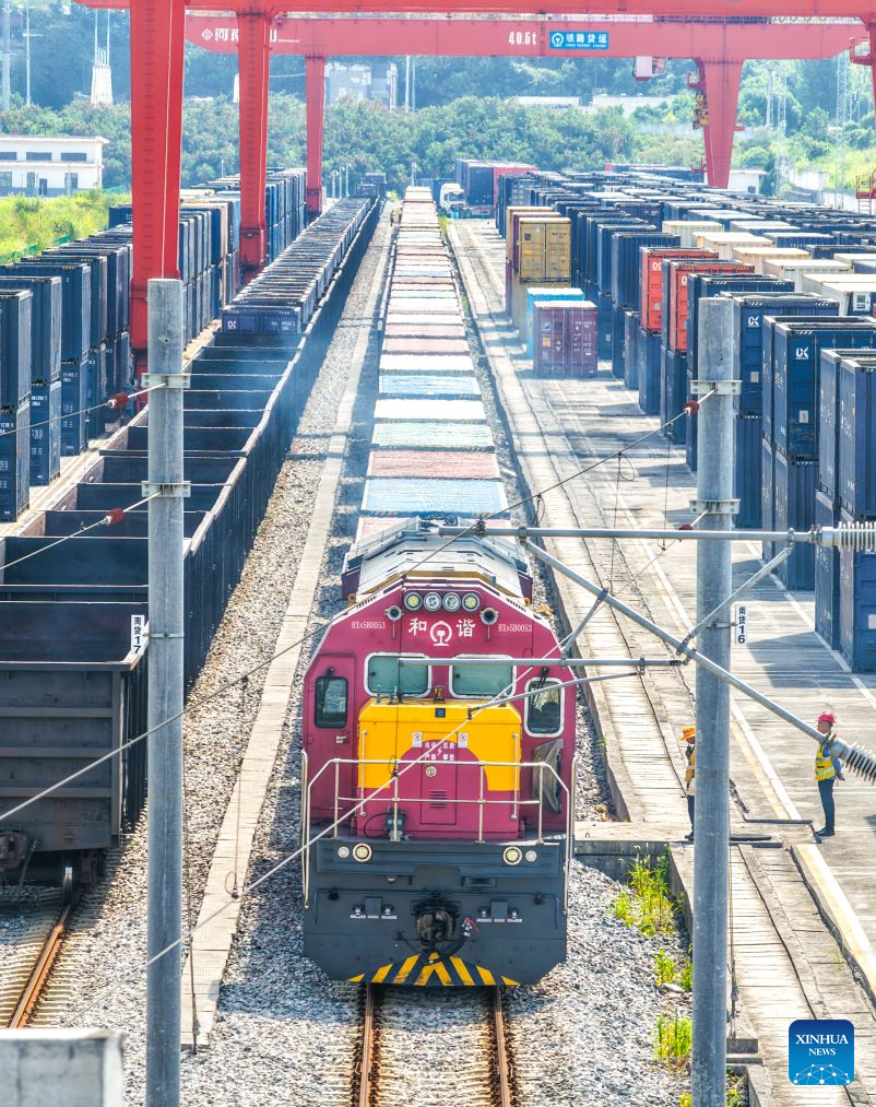 An aerial drone photo taken on July 30, 2026 shows a freight train of the New International Land-Sea Trade Corridor waiting for departure at Yuzui Station in Chongqing, southwest China. A total of 961 rail freight train trips were operated from Chongqing via the New International Land-Sea Trade Corridor in the first half of the year, up 25.6 percent year on year, according to the logistics division of China Railway Chengdu Group Co., Ltd.
Chongqing's imports and exports via the corridor amounted to 28.71 billion yuan (about 4.25 billion U.S. dollars) during the same period, rising 13.7 percent year on year, according to data from Chongqing Customs. (Xinhua/Tang Yi)