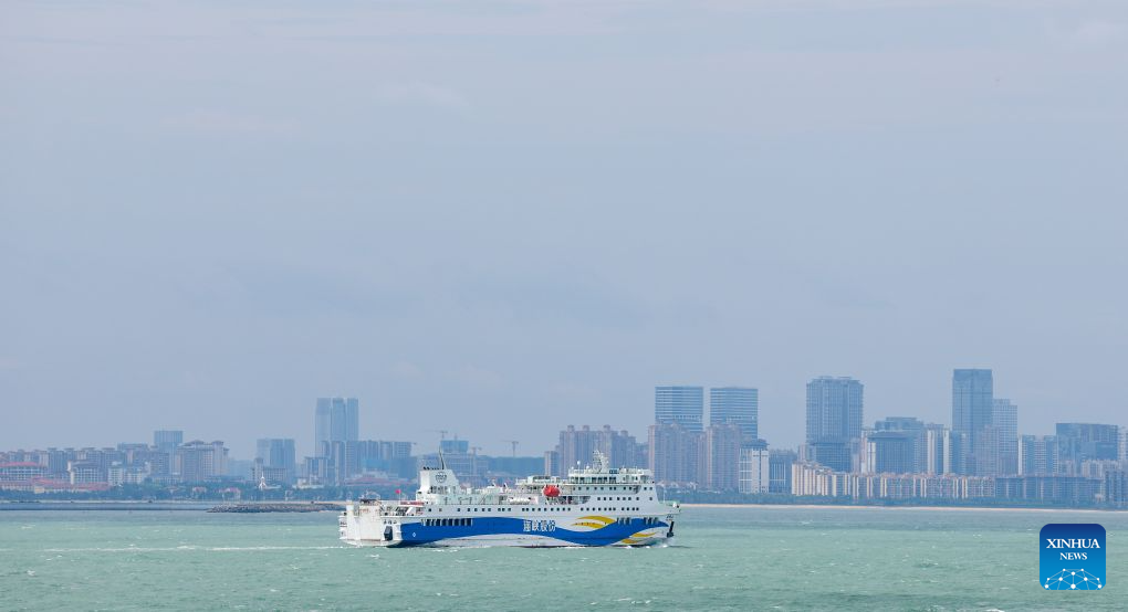 A passenger and freight ferry is pictured at Xiuying Port in Haikou, south China's Hainan Province, Aug. 26, 2026. The passenger and freight ferry services across the Qiongzhou Strait have resumed in an orderly manner on Wednesday afternoon as the impact of Typhoon Narra gradually weakened. (Xinhua/Yang Guanyu)