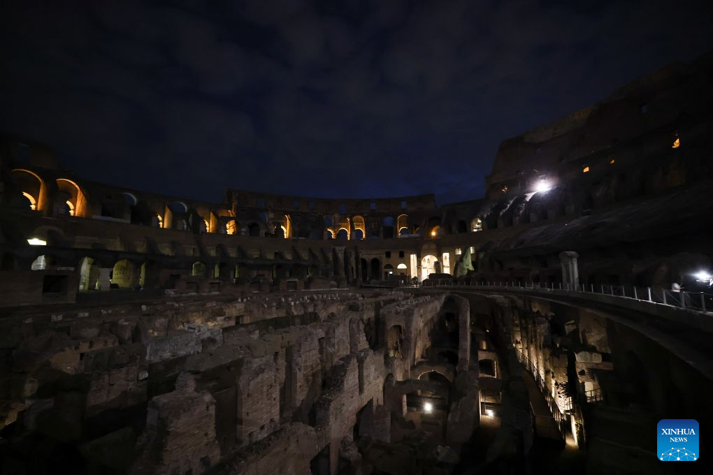 Photo taken in the evening of July 28, 2026 shows the interior view of the Colosseum with lights decorated in Rome, Italy. (Xinhua/Wang Kaiyan)