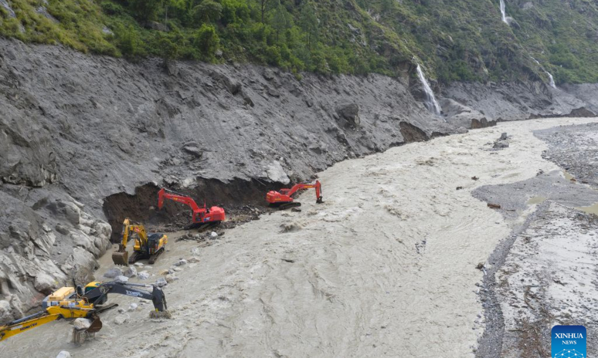 This aerial drone photo shows excavators repairing a section of national highway G216 in Gyirong County, southwest China's Xizang Autonomous Region, on Aug. 31, 2026.

Rescuers with China Anneng are carrying out clearing and restoration operations on the damaged road sections, striving to restore the vital access route to Gyirong Port. (Xinhua/Jiang Fan)