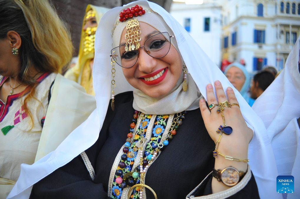 A Tunisian woman in traditional costumes is pictured during the celebration of the annual National Women's Day in Tunis, Tunisia, Aug. 13, 2026. (Photo by Adel Ezzine/Xinhua)