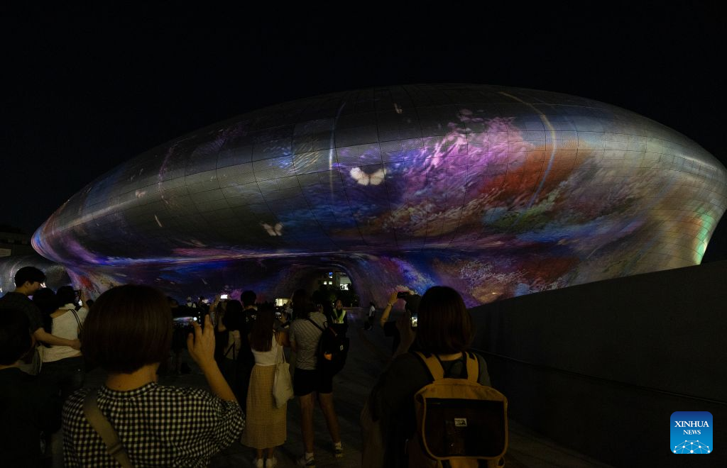 People watch a media art show during Seoul Light DDP 2026 Fall at Dongdaemun Design Plaza (DDP) in Seoul, South Korea, Sept. 8, 2026. The event runs from Sept. 3 to 13 under the theme K-Original Light. (Photo by Jun Hyosang/Xinhua)