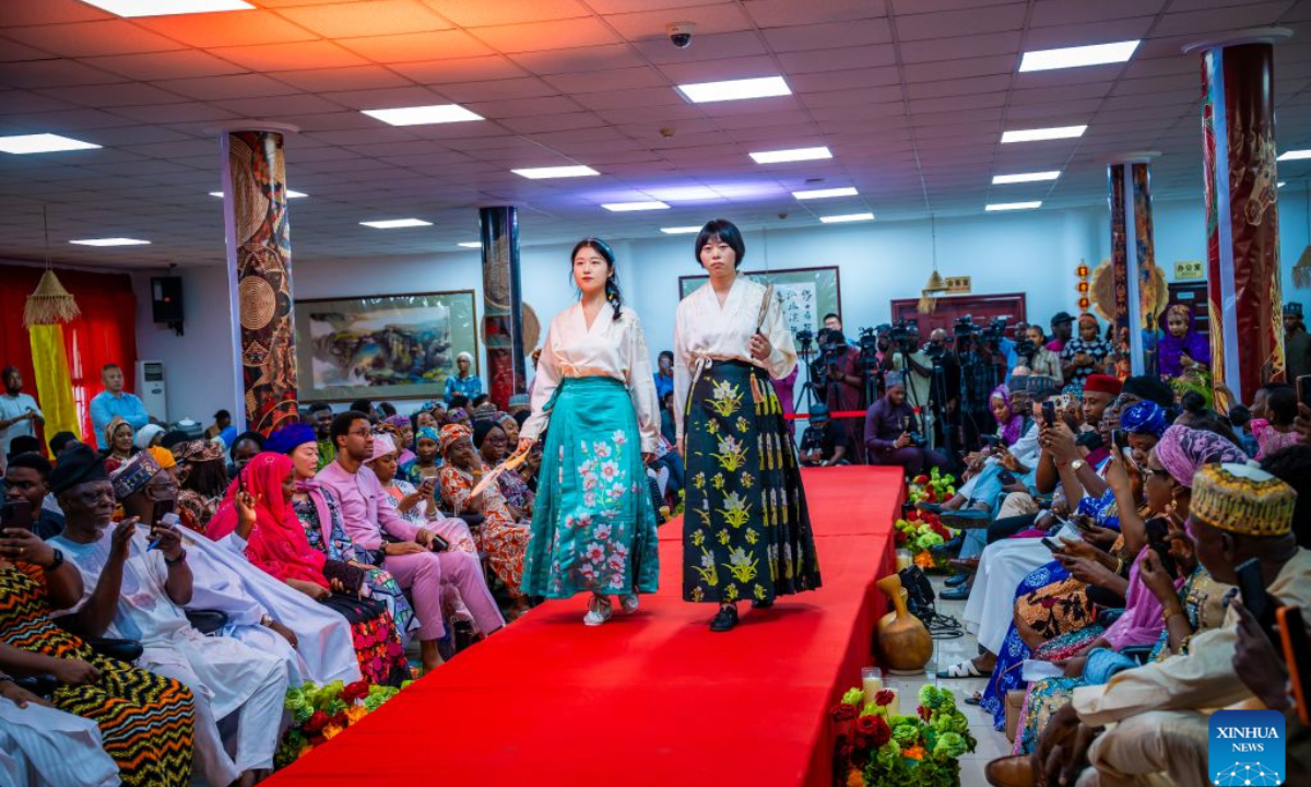 Photo taken on Sept. 18, 2026 shows Chinese models in traditional Chinese costumes performing during the China-Nigeria Fashion Show at the China Culture Center in Abuja, Nigeria. (Photo by Walekazm/Xinhua)