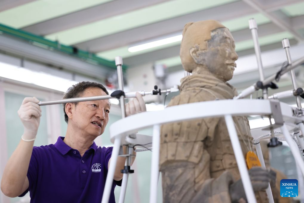 A restoration specialist debugs sensors for terracotta warrior restoration at the on-site conservation lab of the Pit No.1 of the Emperor Qinshihuang's Mausoleum Site Museum in Xi'an, northwest China's Shaanxi Province, Sept. 3, 2026. (Xinhua/Li Yibo)