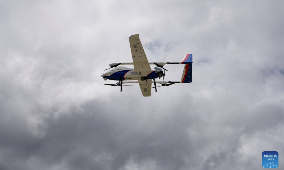 A high-altitude medium-sized composite-wing drone is seen in Gyirong Town, southwest China's Xizang Autonomous Region, Aug. 31, 2026. The local emergency management department in Xizang Autonomous Region has dispatched a drone detection team to carry out disaster assessment missions. The medium-sized composite-wing drone has monitored the conditions of the barrier lake and the mountain terrain in the area affected by the mudslide, providing critical information to support search and rescue operations. (Xinhua/Jigme Dorje)
