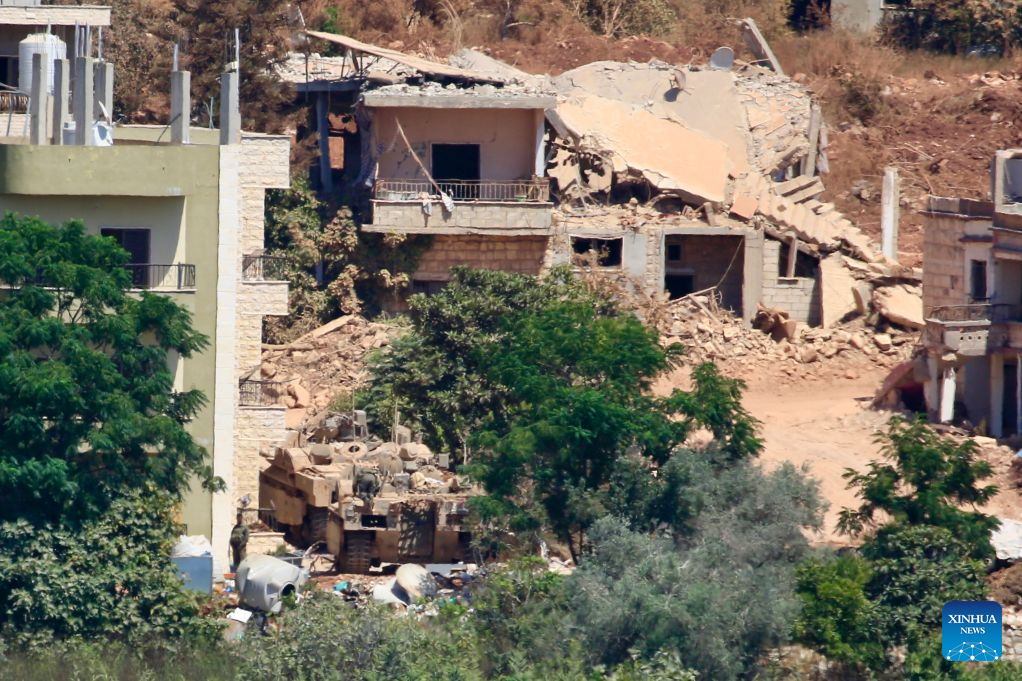 This photo taken on Aug. 3, 2026 shows an Israeli military vehicle stationed in Zawtar al-Sharqiyah, southern Lebanon. The Lebanese army said on July 26 that continued Israeli attacks and violations of existing understandings are obstructing its deployment in southern Lebanon and delaying the return of residents to their border villages. (Photo by Ali Hashisho/Xinhua)