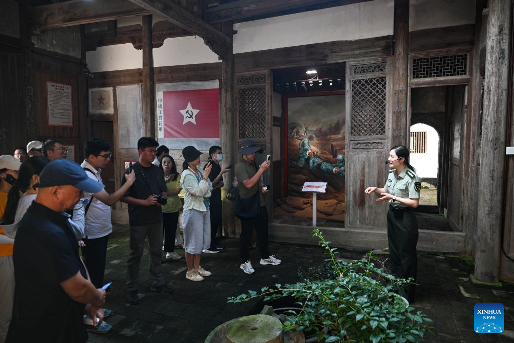 A docent briefs visitors on the history at a former Red Army hospital site in Chentang Village of Shibi Town in Ninghua County, southeast China's Fujian Province, Sept. 9, 2026. This year marks the 90th anniversary of the victory of the Long March by the Red Army under the leadership of the Communist Party of China (CPC). The former Red Army hospital site is located in Chentang Village, Ninghua County, one of the starting points of the Long March by the Central Red Army. (Xinhua/Zheng Huansong)