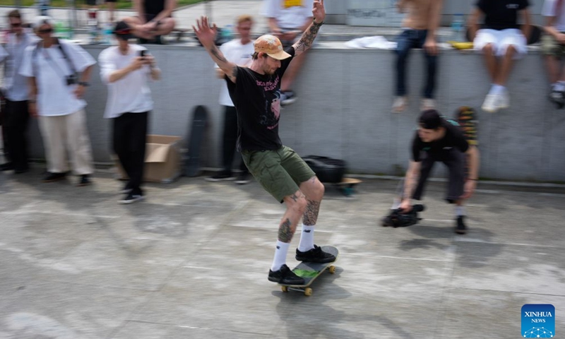 A man rides a skateboard to celebrate the annual Go Skateboarding Day in Warsaw, Poland, June 21, 2026. (Photo by Jaap Arriens/Xinhua)