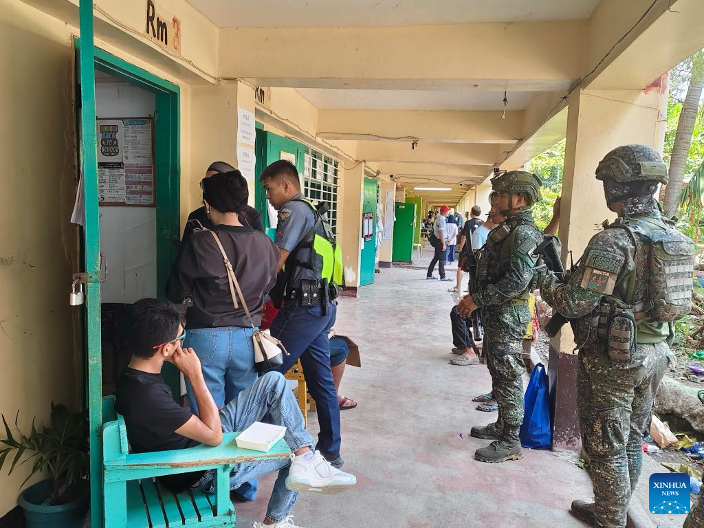 Soldiers and policemen are seen at a polling center during the parliamentary election in the Bangsamoro Autonomous Region in Muslim Mindanao (BARMM), the Philippines, Sept. 14, 2026. The first parliamentary election in the BARMM began on Monday.
According to local media reports, over 2 million voters are eligible to vote for 80 parliamentary seats being contested by 13 parties. Security has been stepped up across the BARMM in recent days, with over 20,000 security personnel deployed to polling areas and rapid response teams set up to deal with potential violence. (Armed Forces of the Philippines/Handout via Xinhua)