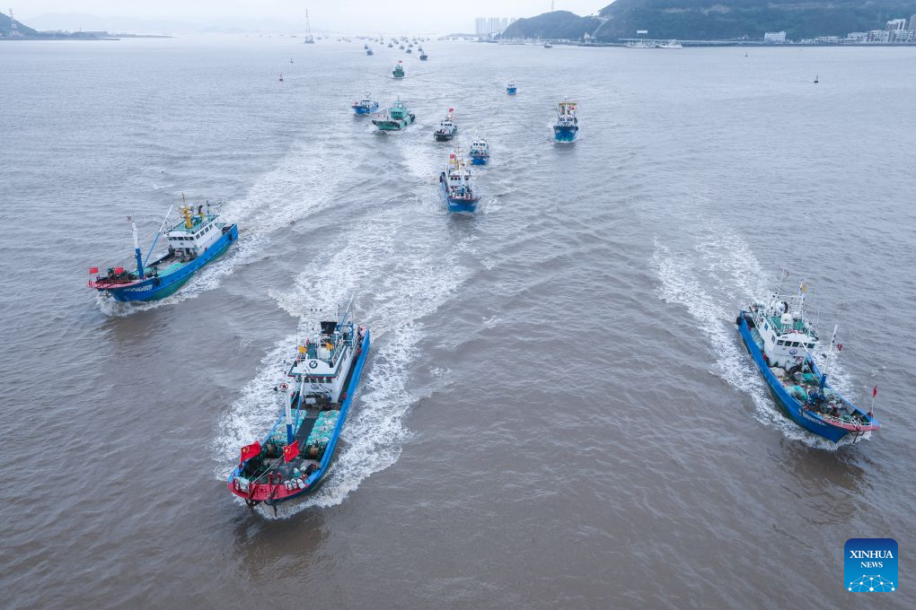 Fishing boats set sail for fishing from Shenjiamen Port in Zhoushan, east China's Zhejiang Province, Aug. 11, 2026. Four types of fishing boats with special permission set sail on Tuesday after a three-month summer fishing ban in the East China Sea. The opening of the fishing season was delayed from the originally scheduled Aug. 5 due to Typhoon Dolphin. (Xinhua/Xu Yu)