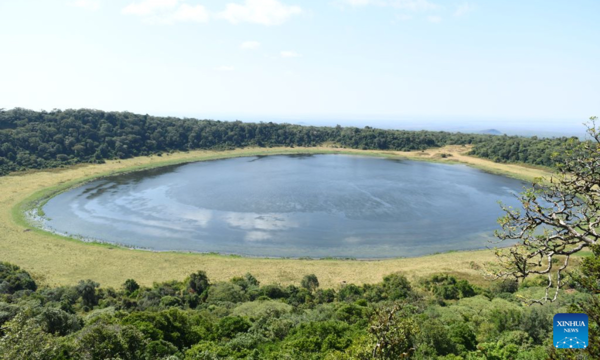 This photo taken on July 14, 2026, shows a crater lake inside Marsabit National Park, Marsabit County, Kenya. Marsabit County features contrasting landscapes: the dry Chalbi Desert and green, lake-strewn Marsabit National Park. (Xinhua/Liu Qiong)