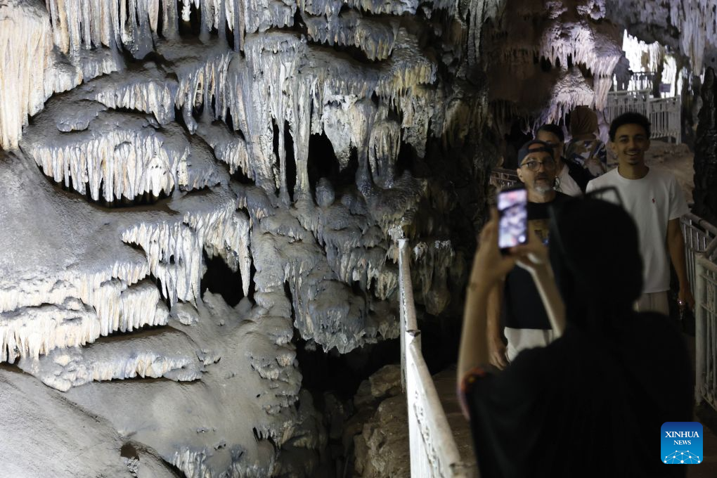 People visit the Beni Add caves in Tlemcen, Algeria, Aug. 17, 2026. The main gallery of Beni Add caves extend over 700 meters, with a depth reaching 57 meters, and are home to stalactites and stalagmites of varied shape. (Photo by Billel Bensalem/Xinhua)
