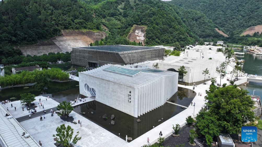 A drone photo taken on June 28, 2026 shows tourists visiting a Xuan paper cultural town in Jingxian County, east China's Anhui Province. (Photo by Nie Fang/Xinhua)