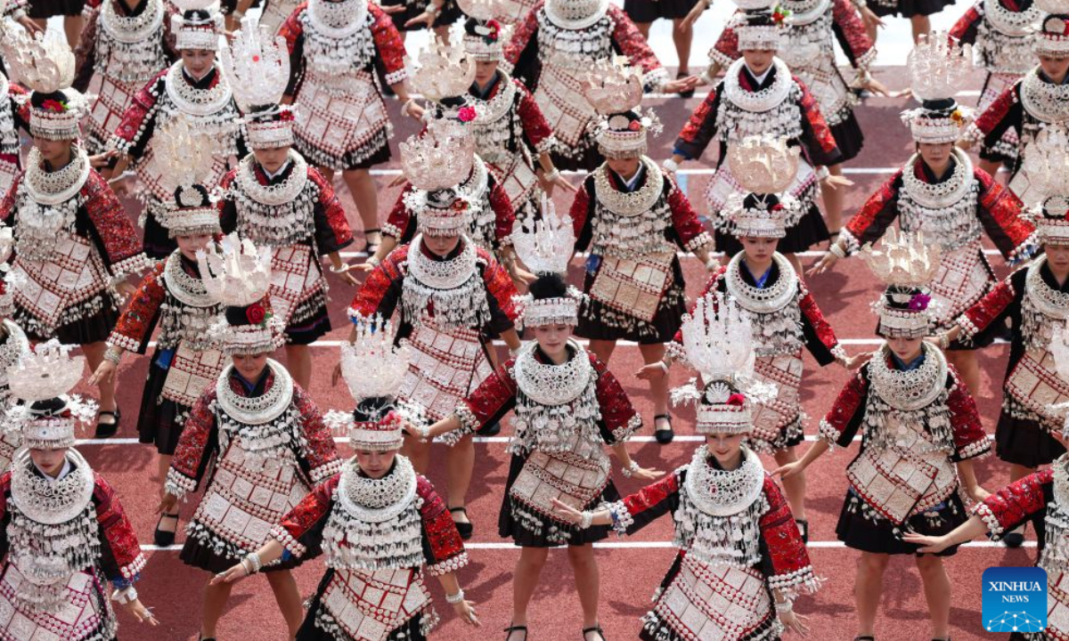 People from ethnic minority groups perform during a ceremony marking the 70th anniversary of the founding of Qiandongnan Miao and Dong Autonomous Prefecture in Kaili, Qiandongnan Miao and Dong Autonomous Prefecture, southwest China's Guizhou Province, July 23, 2026. Qiandongnan Miao and Dong Autonomous Prefecture, established on July 23, 1956, is home to 4.9 million people of the Miao, Dong, Han and other ethnic groups. (Xinhua/Yang Wenbin)