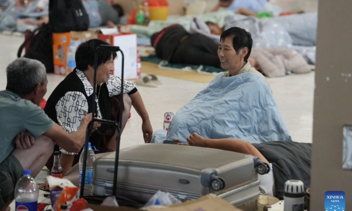 People rest at a resettlement site at a middle school in Yuhuan City, east China's Zhejiang Province, Aug. 27, 2026. East China's Zhejiang Province raised its typhoon emergency response to Level I, the highest level, at 8 p.m. Thursday as Typhoon Saudel, the 18th typhoon of this year, is forecast to make landfall in the province. (Xinhua/Huang Zongzhi)