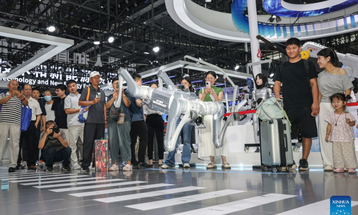 Visitors watch a robot performance at the 2026 World Manufacturing Convention (WMC) in Hefei, east China's Anhui Province, Sept. 20, 2026. Themed Intelligent Manufacturing For a Better Future, the 2026 WMC kicked off here on Sunday. (Xinhua/Chang Nengjia)