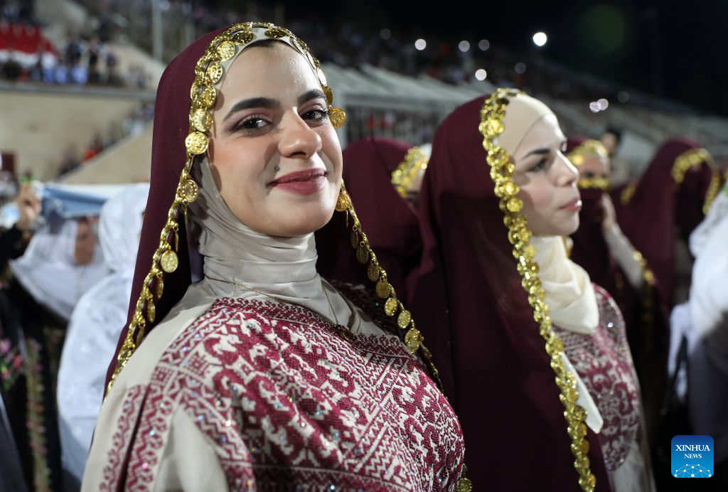 Brides attend a mass wedding ceremony in Dura near the West Bank city of Hebron, on Sept. 26, 2026. The mass wedding ceremony brought together 88 Palestinian grooms and brides, with thousands of local residents attending the event. (Photo by Mamoun Wazwaz/Xinhua)