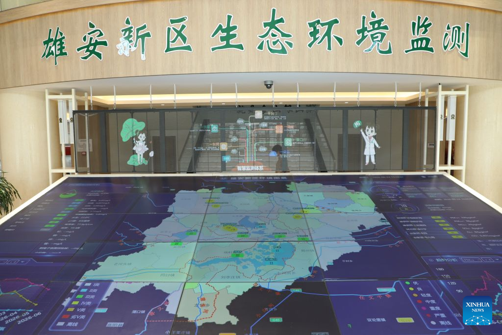 This photo taken on June 24, 2026 shows a view of the ecological and environmental monitoring center of Xiong'an New Area in north China's Hebei Province. Since the establishment of Xiong'an New Area, Baiyangdian Lake has undergone large-scale ecological restoration efforts, including pollution control, dredging, ecological water replenishment and wetland restoration. The lake's water quality reached Grade III under China's surface water quality standards in 2021 and has remained stable at that level for five consecutive years. (Photo by Liang Jiayuan/Xinhua)
