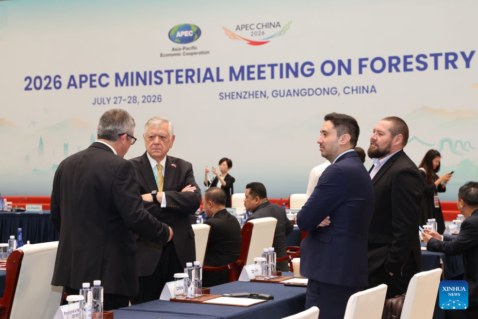 Attendees communicate during the 2026 APEC Ministerial Meeting on Forestry in Shenzhen, south China's Guangdong Province, July 28, 2026. The meeting was held in Shenzhen from July 27 to 28. (Xinhua/Liang Xu)