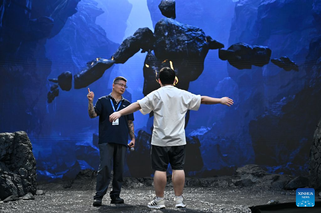 A visitor experiences motion capture technique during the 33rd Beijing International Radio, TV & Film Exhibition (BIRTV 2026) in Beijing, capital of China, Aug. 20, 2026. The ongoing 33rd Beijing International Radio, TV & Film Exhibition is held here from Aug. 19 to Aug. 22. (Xinhua/Zheng Huansong)