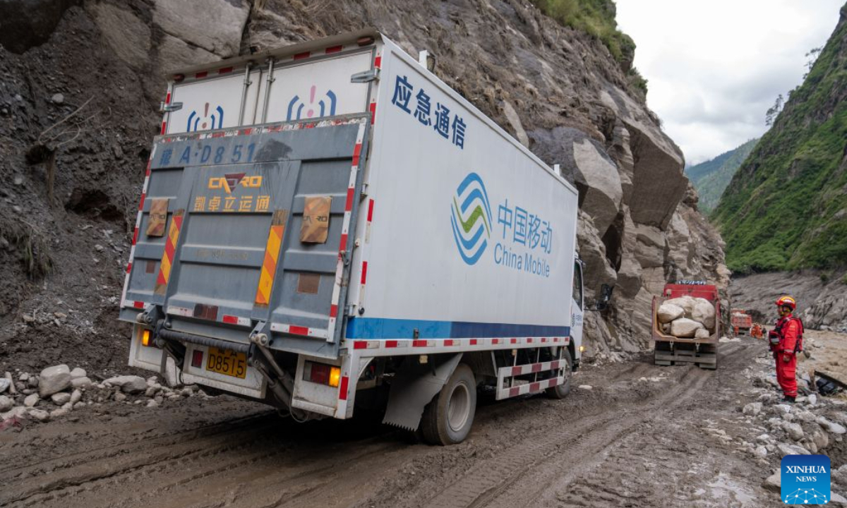 A vehicle of the communication operator is pictured at the mudslide-hit area in Gyirong County, southwest China's Xizang Autonomous Region, Aug. 30, 2026. A newly-built 4G/5G base station, approximately 900 meters from the mudslide-hit Gyirong Port in Gyirong County, was put into use on Sunday, ensuring more stable communication signals at the core rescue site. (Xinhua/Tenzing Nima Qadhup)