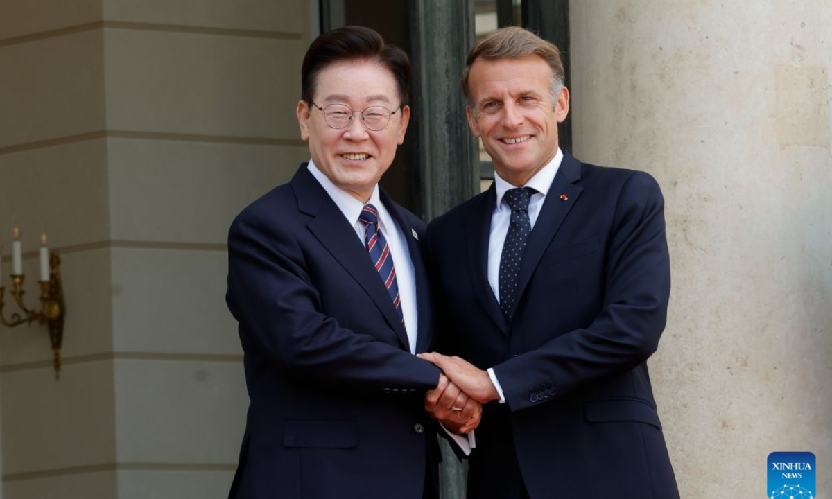 French President Emmanuel Macron (R) shakes hands with South Korean President Lee Jae Myung at Elysee Palace in Paris, France, Sept. 8, 2026. (Photo by Henri Szwarc/Xinhua)