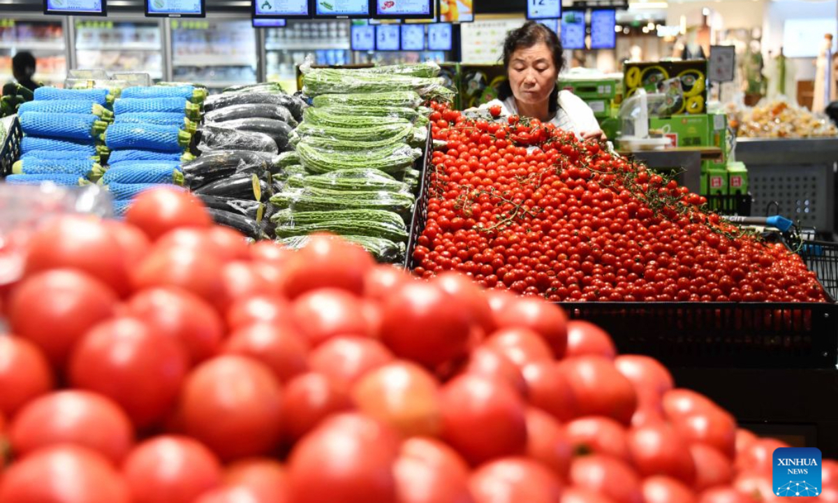 A consumer shops at a supermarket in Hebi City, central China's Henan Province, July 9, 2026. The consumer price index (CPI), a main gauge of inflation, rose 1 percent year on year in the first six months of 2026, data from the National Bureau of Statistics (NBS) revealed. In June alone, the CPI gained 1 percent year on year and edged down 0.3 percent month on month, with the core CPI, which excludes food and energy prices, increasing by 1 percent year on year, continuing the moderate upward trend. (Photo by Zhao Yongqiang/Xinhua)