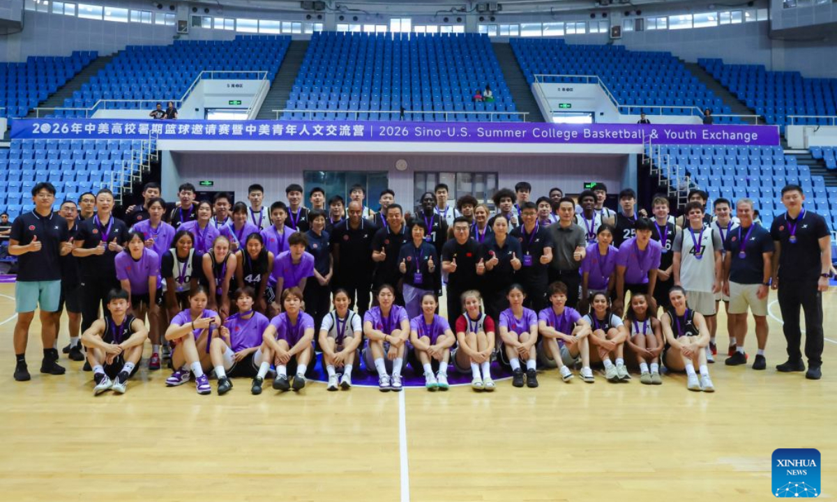 Chinese and American college students pose for a group photo at Tsinghua University's sports complex in Beijing, capital of China, Aug. 16, 2026. (Xinhua)