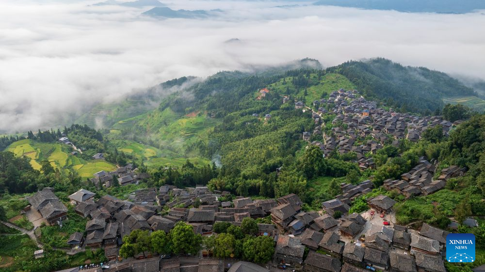 An aerial drone photo taken on Aug. 20, 2026 shows a view of the Basha Village in Congjiang County of Qiandongnan Miao and Dong Autonomous Prefecture, southwest China's Guizhou Province. Located seven kilometers away from the county seat of Congjiang, Basha Village has attracted an increasing number of overseas tourists with its charming scenery and simple folk customs recently.
Consisting of five hamlets and inhabited by the Miao people, the village was included in the first batch of China's traditional villages in 2012. Riding the viral Chinamaxxing wave on social media, foreign tourists have come here to experience ancient ways of life and profound cultural heritage.
Data from the National Immigration Administration shows that China recorded 22.91 million inbound foreign visits in the first half of this year, up 20.4 percent year on year. (Photo by Wu Dejun/Xinhua)
