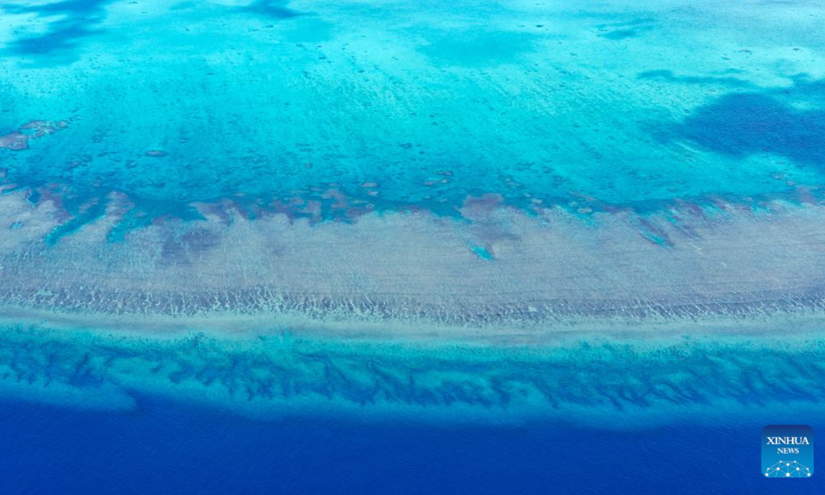 An aerial drone photo taken on July 8, 2026 shows the coral reef flat in the territorial waters of China's Huangyan Dao in the South China Sea. Huangyan Dao, located in China's Zhongsha Qundao, features a unique coral reef ecosystem and special geological structures. It is home to numerous rare and endangered species, making it an area of high biodiversity and species rarity.
Huangyan Dao is China's inherent territory. In September 2025, China formally approved to establish the Huangyan Dao National Nature Reserve.
The China Coast Guard has carried out regular patrols and law enforcement to safeguard China's territorial sovereignty, maritime rights and interests, and ecological environment in the waters of the reserve. (Xinhua/Wang Peng)