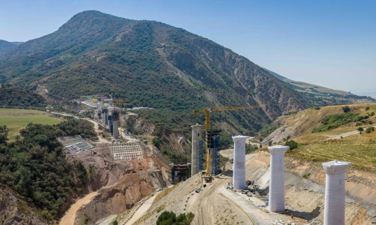 An aerial drone photo taken on Aug. 15, 2026 shows a construction site of a grand bridge above the Kec-Alat River along the China-Kyrgyzstan-Uzbekistan railway in Jalalabad, Kyrgyzstan. (Xinhua/Li Renzi)