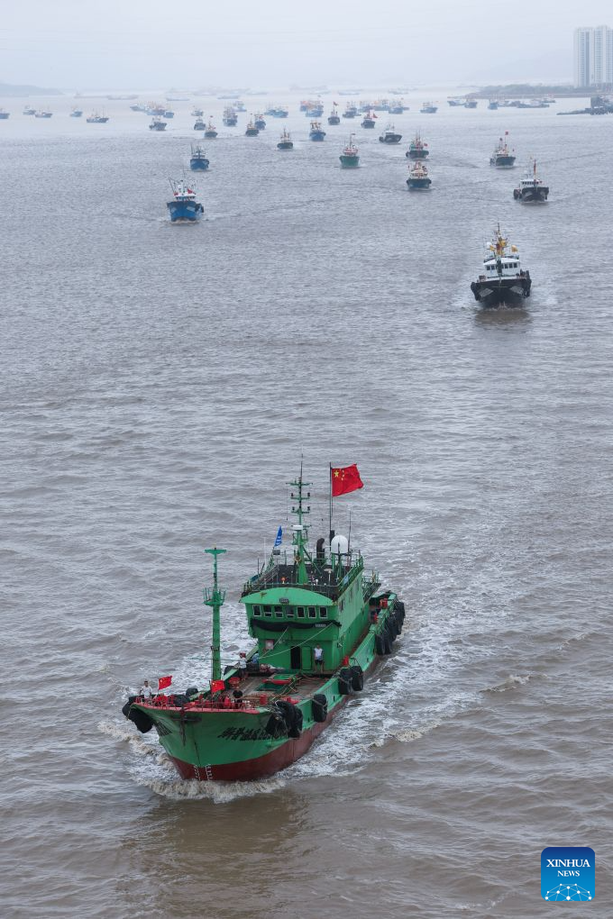 Fishing boats set sail for fishing from Shenjiamen Port in Zhoushan, east China's Zhejiang Province, Aug. 11, 2026. Four types of fishing boats with special permission set sail on Tuesday after a three-month summer fishing ban in the East China Sea. The opening of the fishing season was delayed from the originally scheduled Aug. 5 due to Typhoon Dolphin. (Xinhua/Xu Yu)