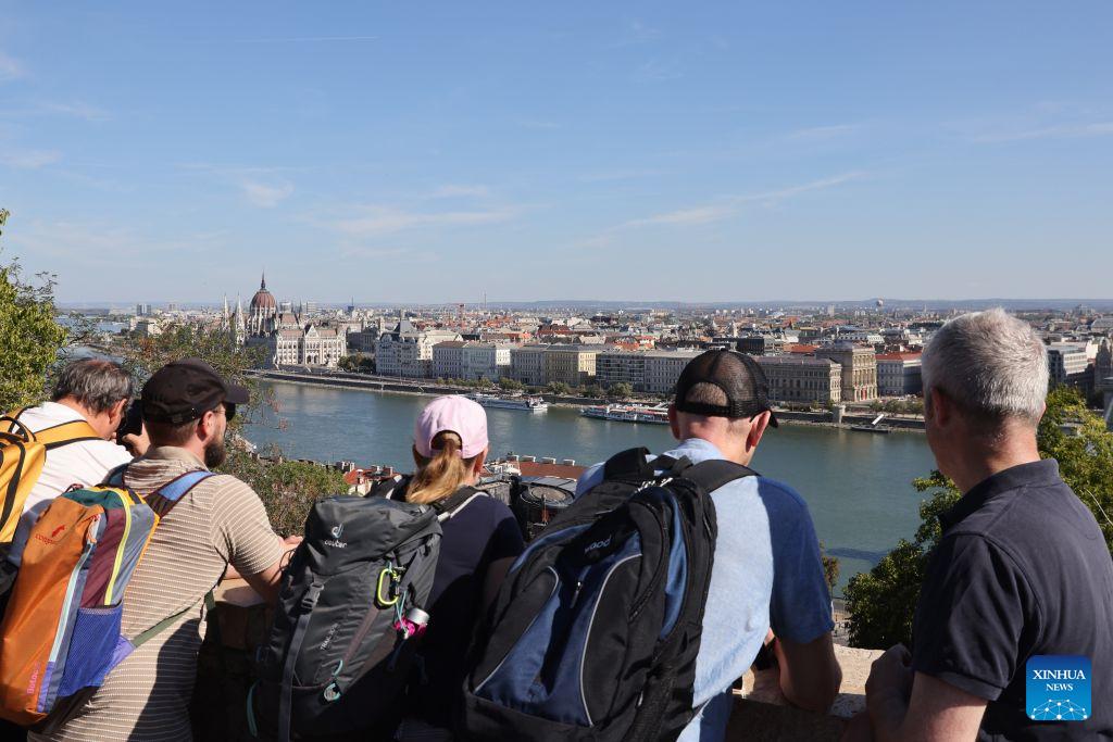 People take a look at the Hungarian Parliament building in Budapest, Hungary, Sept. 20, 2026. Hungary marked Cultural Heritage Days on Saturday and Sunday with numerous historic buildings and spaces open to the public. (Photo by Attila Volgyi/Xinhua)