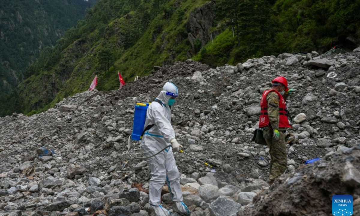 A worker conducts disinfection operations at the mudslide-hit area in Gyirong County, southwest China's Xizang Autonomous Region, Aug. 30, 2026. Disinfection operations were carried out after a devastating mudslide, triggered by an ice-rock avalanche in Nepal, hit the border port of Gyirong in southwest China's Xizang Autonomous Region. (Xinhua/Jigme Dorje)