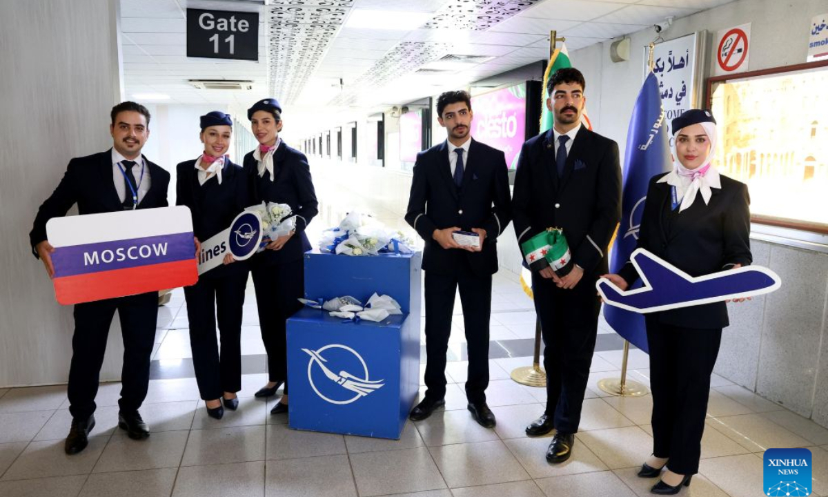 Syrian Airlines crew members pose for a photo during a ceremony marking the resumption of direct flights between Damascus and Moscow at Damascus International Airport in Damascus, Syria, Aug. 16, 2026. Syrian Airlines resumed regular direct flights between Damascus and Moscow on Sunday after a suspension of more than 18 months. (Photo by Ammar Safarjalani/Xinhua)