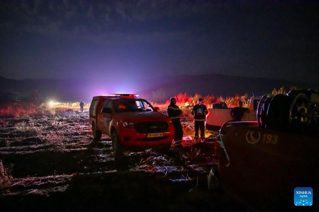 Firefighters are seen in an operation to control a spreading wildfire fueled by weeks of extreme summer heat and dry vegetation in Strumica, North Macedonia, Aug. 22, 2026. (Photo by Tomislav Georgiev/Xinhua)