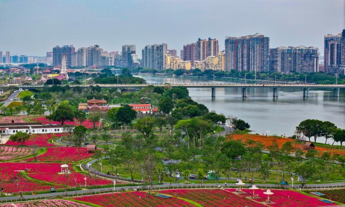 A drone photo taken on April 11, 2026 shows the Long Jiang Years tourist area and the surrounding urban landscape in Zhangzhou City, southeast China's Fujian Province. (Xinhua/Jiang Kehong)
