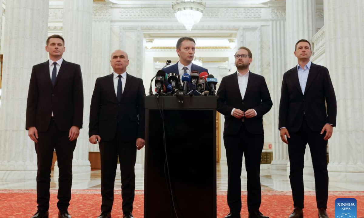 Romania's Prime Minister-designate Siegfried Muresan (C) delivers a speech to the media at the Parliament Palace in Bucharest, Romania, Sept. 18, 2026. (Photo by Cristian Cristel/Xinhua)