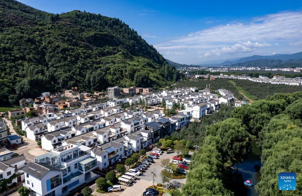 An aerial drone photo taken on Aug. 13, 2026 shows a view of Lyuyintang Natural Village of Xunlong Village, Sayu Town, Zhaoyang District, Zhaotong City, southwest China's Yunnan Province. In recent years, Zhaoyang District in Zhaotong City has leveraged its cool and pleasant climate to boost the in-depth sojourn tourism experience as a summer retreat.

The local government has introduced special support policies for summer retreat tourism, optimizing services including dining, lodging, transportation, sightseeing, shopping, and entertainment. (Xinhua/Chen Xinbo)