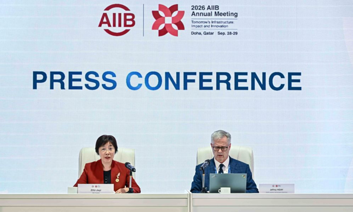 AIIB President Zou Jiayi (L) meets the press during the 11th annual meeting of the Board of Governors of the Asian Infrastructure Investment Bank (AIIB) in Doha, Qatar, on Sept. 28, 2026. The Asian Infrastructure Investment Bank (AIIB) Monday opened its 11th annual meeting of the Board of Governors in Doha, Qatar, bringing together governors, senior officials, clients, partners and stakeholders under the theme Tomorrow's Infrastructure: Impact and Innovation. (Photo by Nikku/Xinhua)
