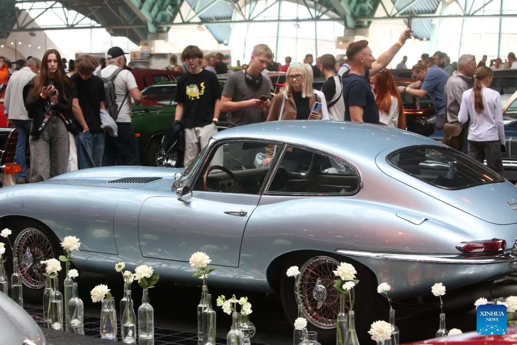 People visit a vintage car show in Minsk, Belarus, Aug. 29, 2026. (Photo by Henadz Zhinkov/Xinhua)