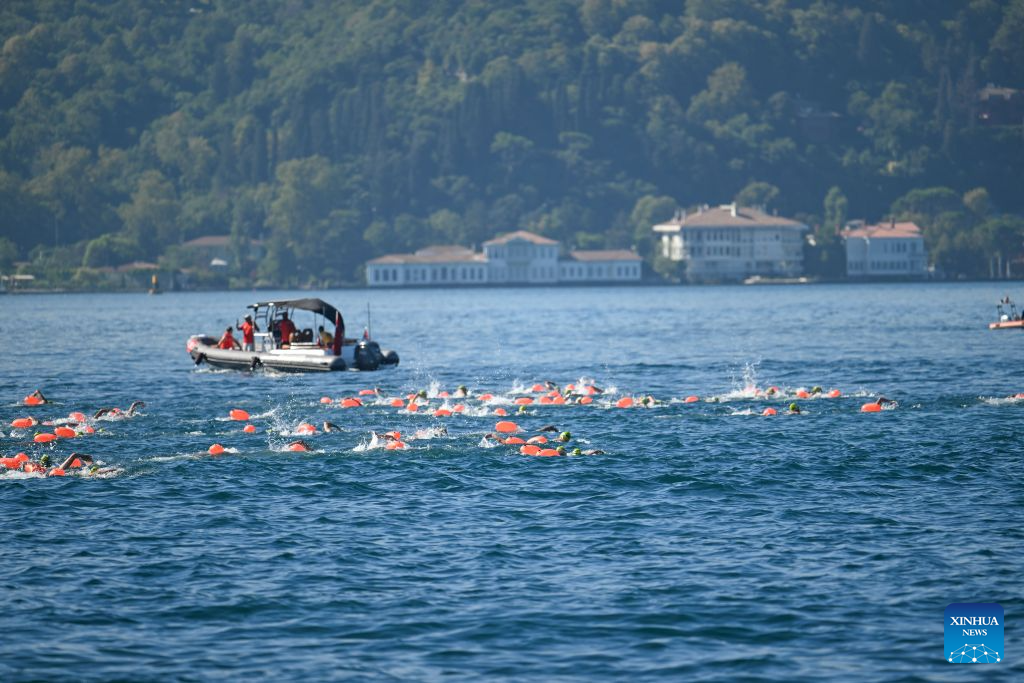 Swimmers compete during the 38th Bosphorus Cross-Continental Swimming Race in Istanbul, Türkiye, Aug. 23, 2026. (Xinhua/Liu Lei)
