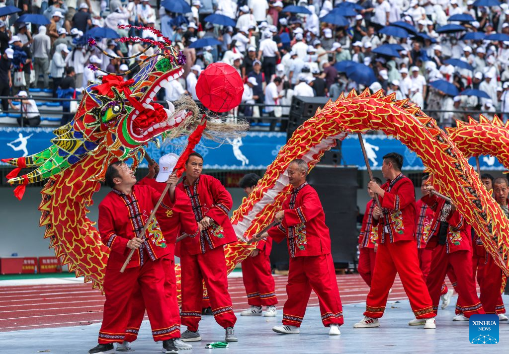 People perform a dragon dance during a ceremony marking the 70th anniversary of the founding of Qiandongnan Miao and Dong Autonomous Prefecture in Kaili, Qiandongnan Miao and Dong Autonomous Prefecture, southwest China's Guizhou Province, July 23, 2026. Qiandongnan Miao and Dong Autonomous Prefecture, established on July 23, 1956, is home to 4.9 million people of the Miao, Dong, Han and other ethnic groups. (Xinhua/Yang Wenbin)