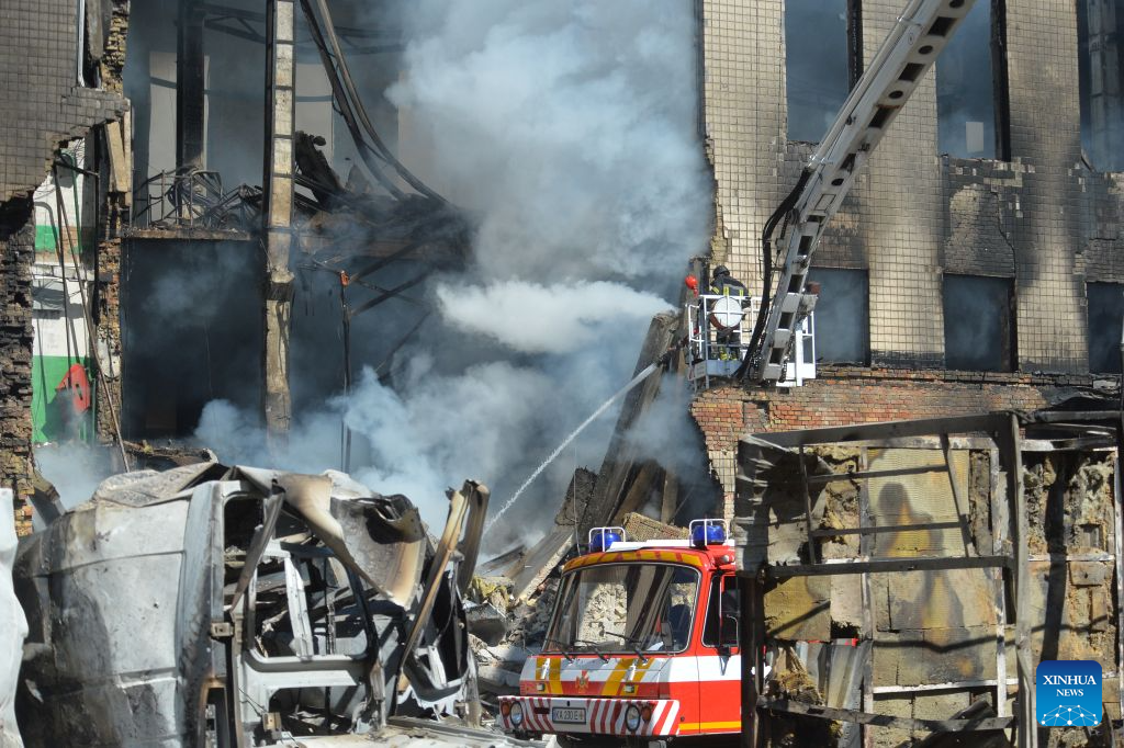 This photo taken on Sept. 8, 2026 shows firefighters working to put out a fire on a building after Russian strikes in Kiev, Ukraine. Seven people were killed as Russia struck Kiev region with drones and missiles overnight. (Photo by Peter Druk/Xinhua)