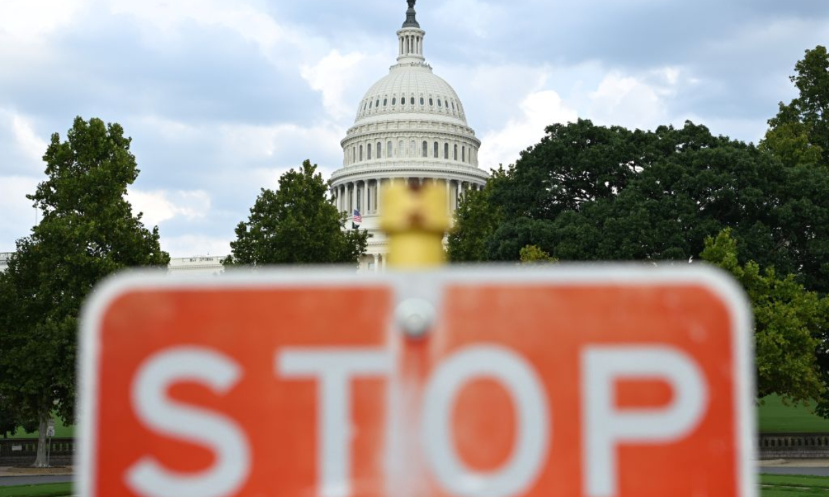 This photo taken on Aug. 28, 2026 shows a stop sign with the U.S. Capitol building in the background in Washington, D.C., the United States. (Xinhua/Li Rui)