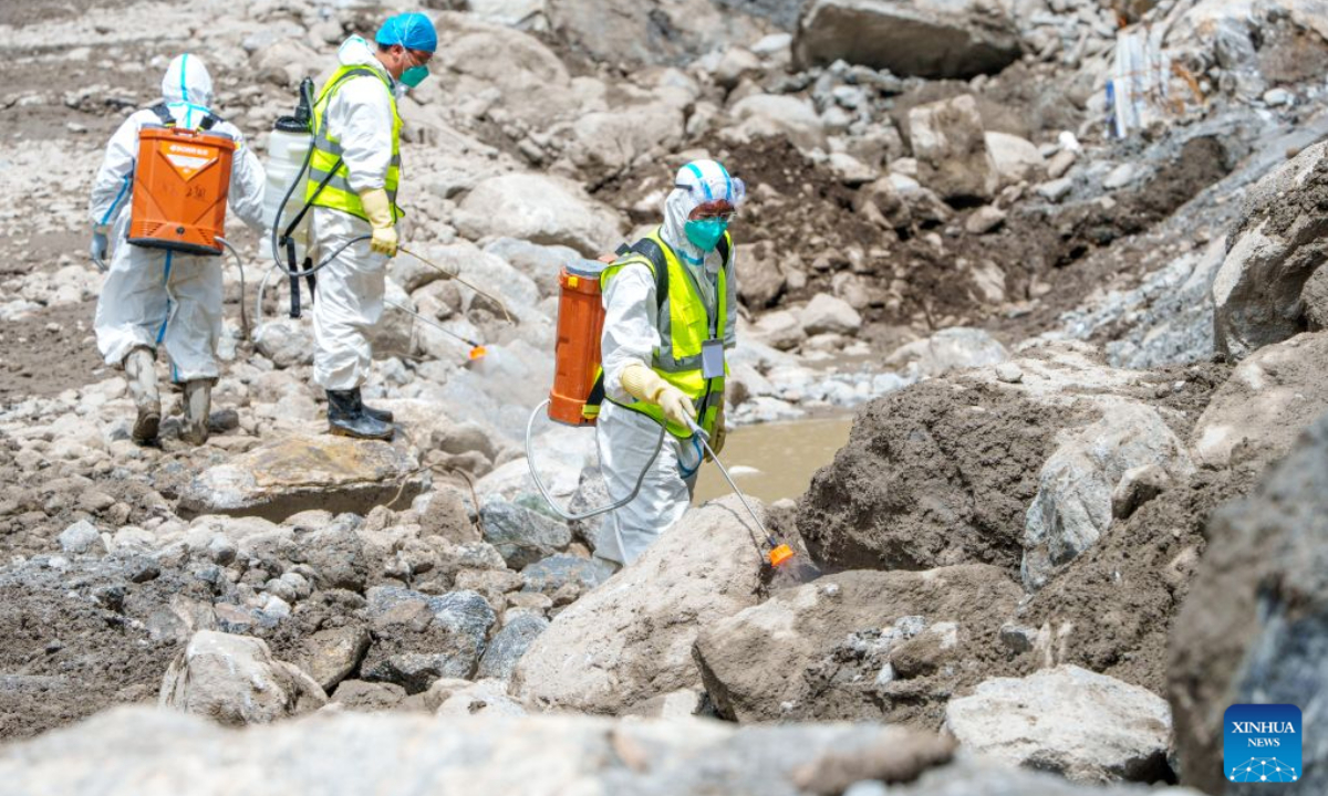 Health workers carry out disinfection work at the core affected zone of the mudslide-hit Gyirong Port in southwest China's Xizang Autonomous Region, Sept. 3, 2026. Teams of health workers from multiple units carried out comprehensive disinfection work at the core affected zone of the mudslide-hit Gyirong Port on Thursday. To date, a total of 35,500 square meters have been disinfected. (Xinhua/Tenzin Nyida)