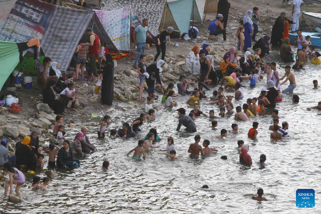 People cool themselves in the Nile River during a heatwave in Cairo, Egypt, Aug. 3, 2026. (Xinhua/Ahmed Gomaa)